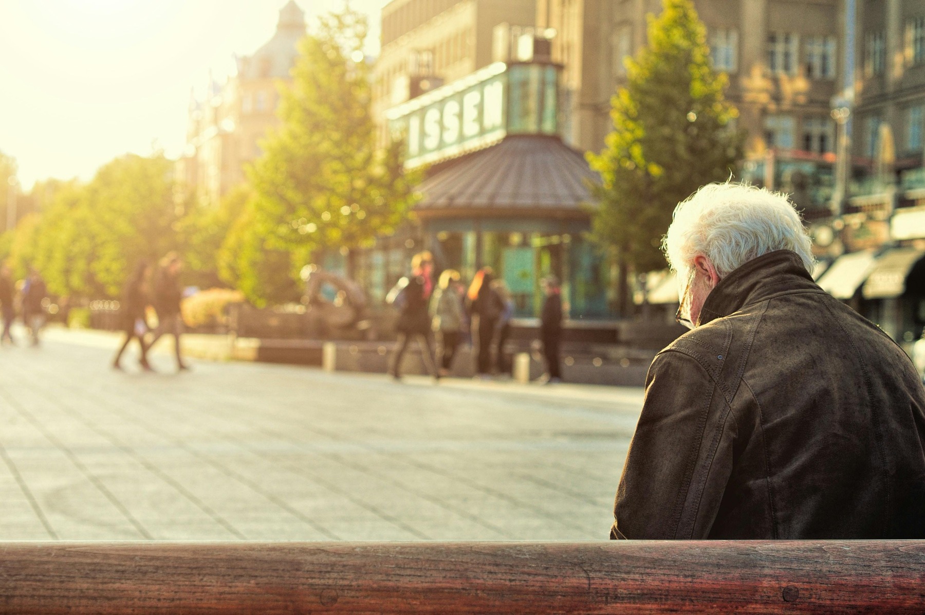 Elderly man sitting on a bench